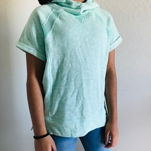 A Light Blue/Green Hoodie With Mesh.